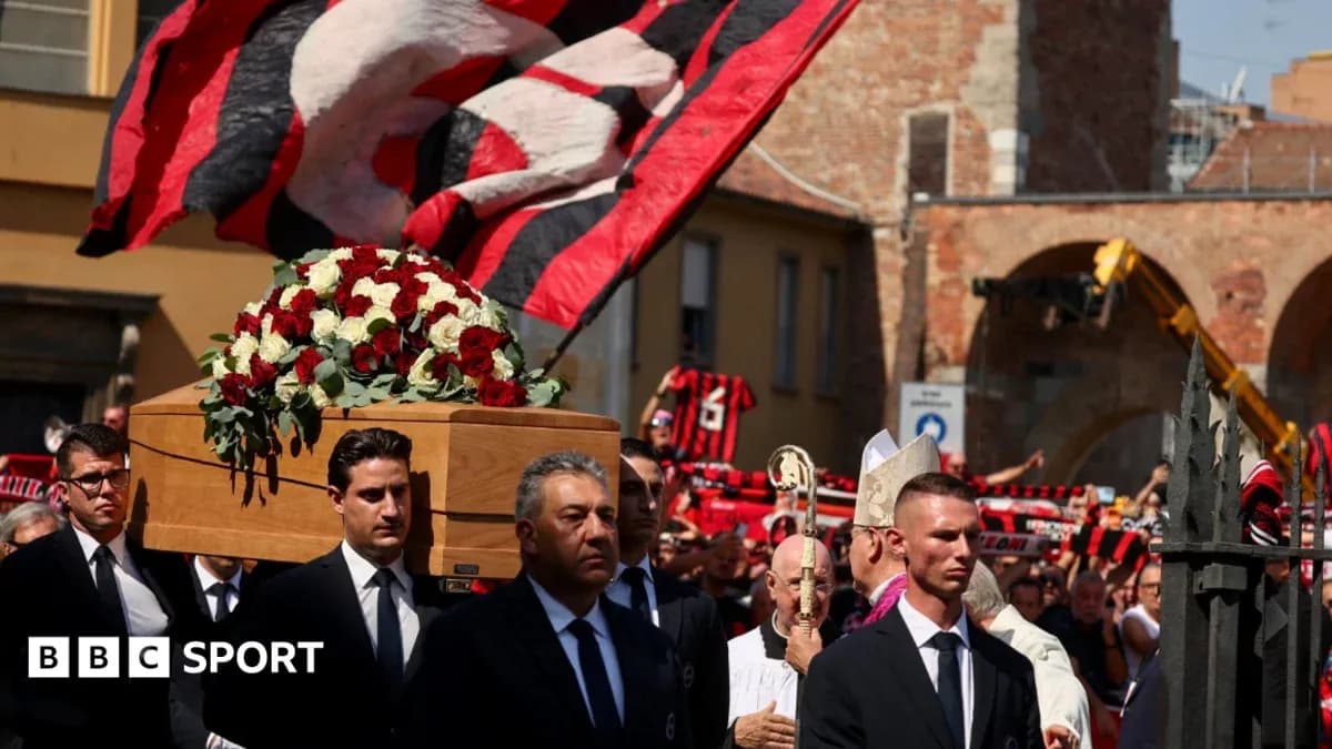 Funeral procession with coffin and mourners in city