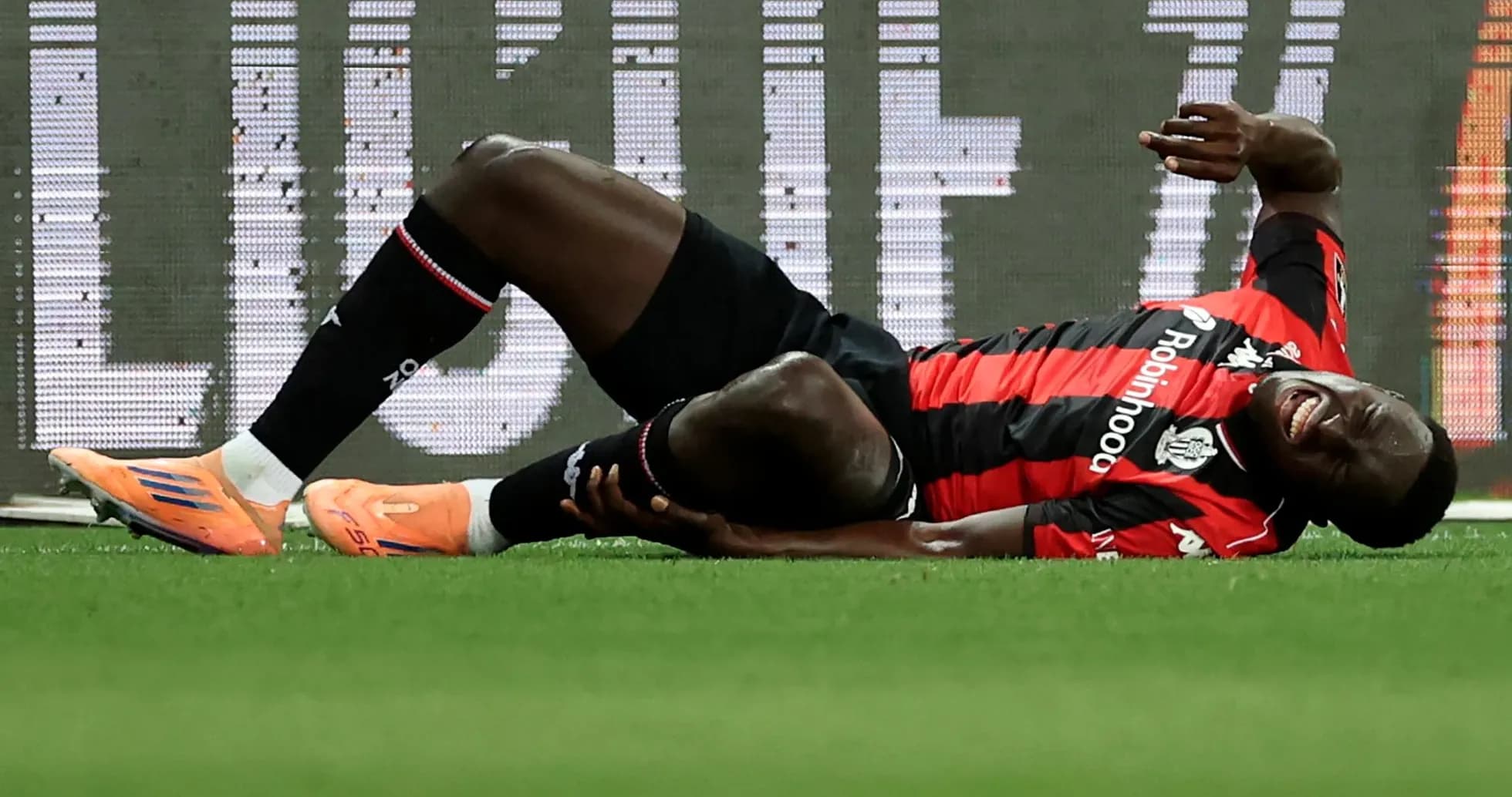 Player lying on the ground, injured during match