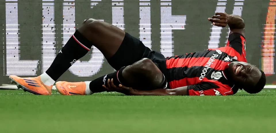 Player lying on the ground, injured during match