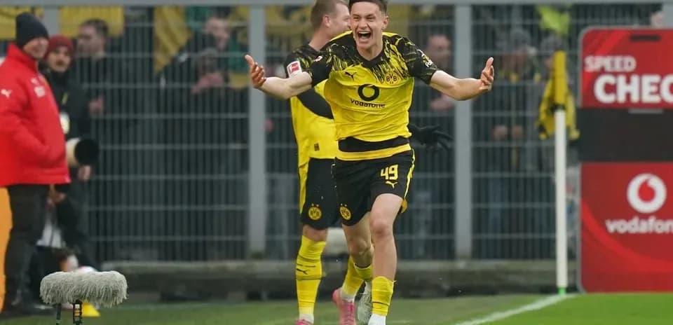 Player celebrating after scoring a goal for Borussia Dortmund