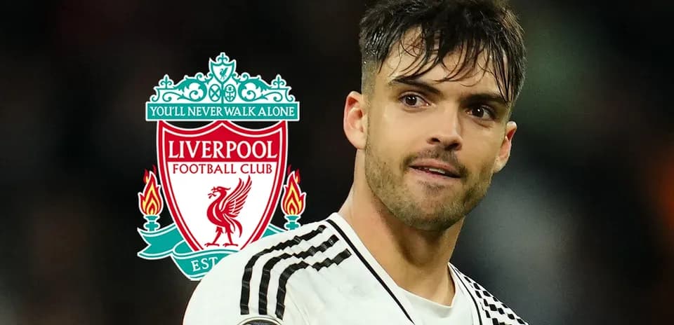 Player in front of Liverpool FC logo during match