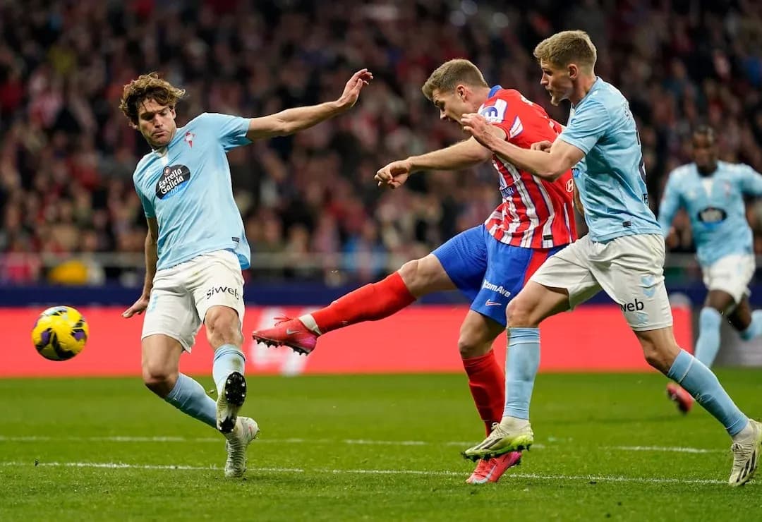 Atletico Madrid player kicking the ball