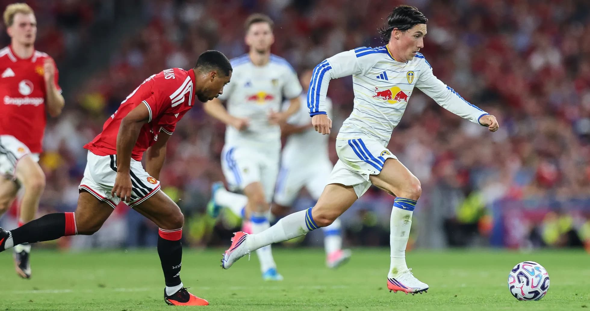Player sprinting with ball during match action