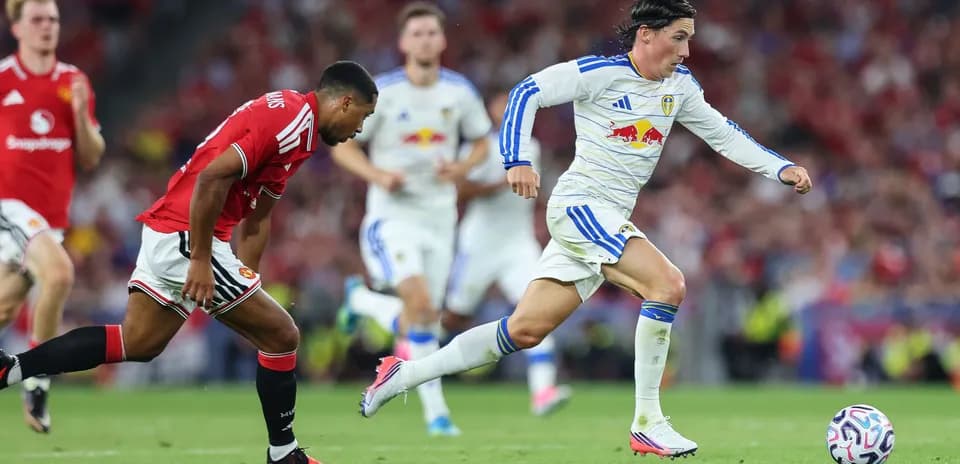 Player sprinting with ball during match action