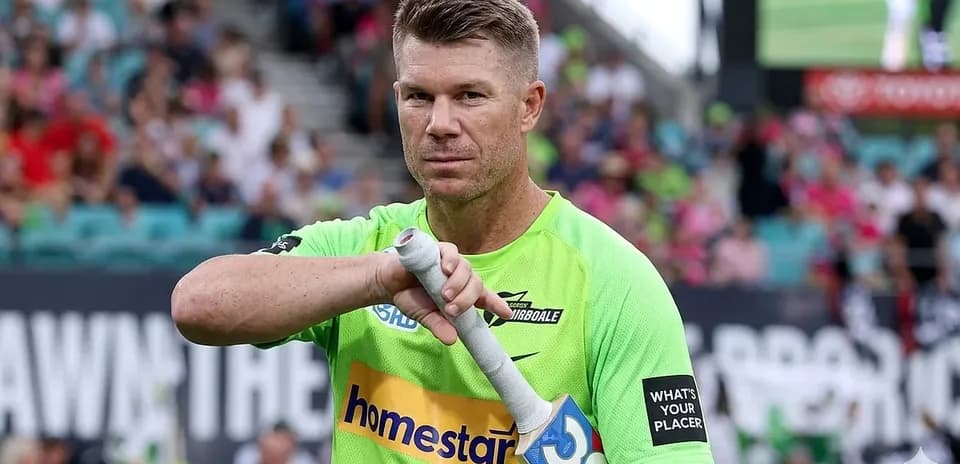 Player preparing to bat during cricket match