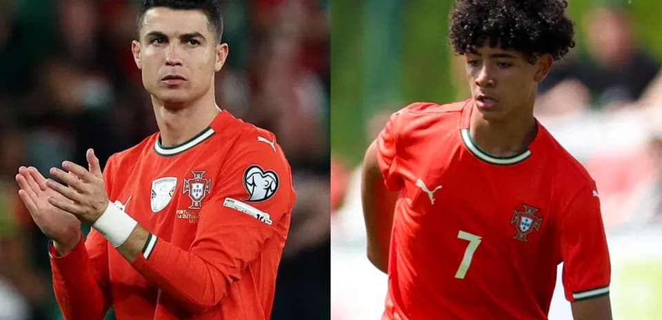 Two Portuguese players in red kits during match