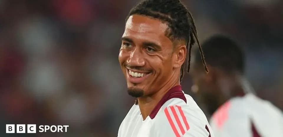 Player smiling during warm-up on the pitch