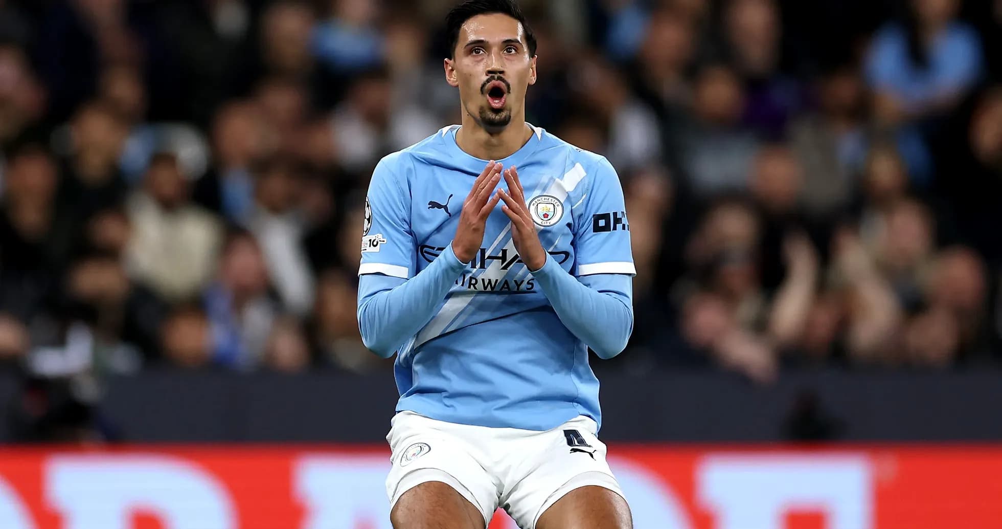 Player in light blue jersey reacting during match