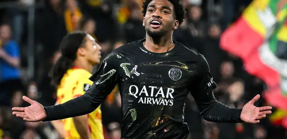 Player celebrating goal in PSG black kit