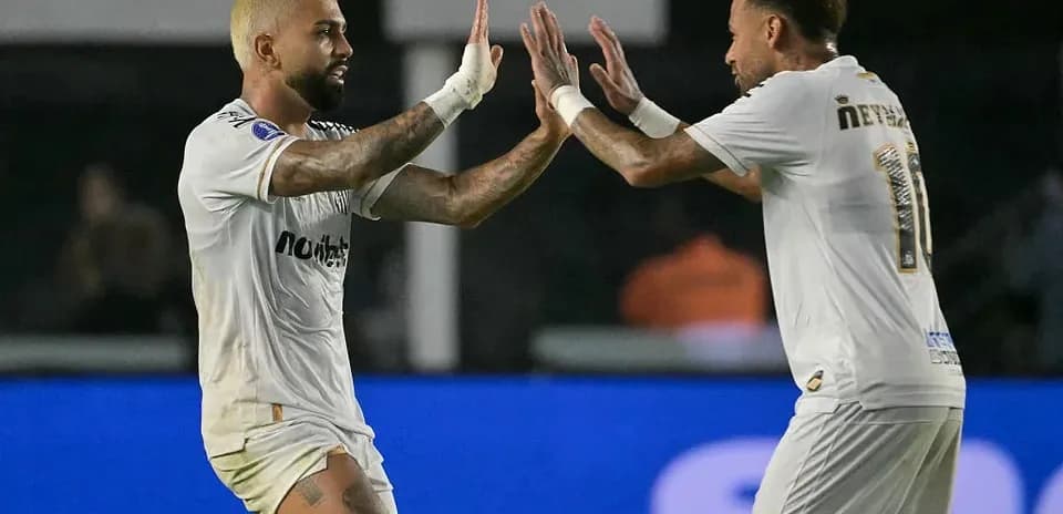 Two players celebrating a goal during match