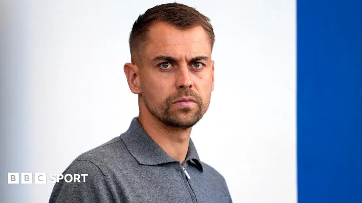 Man in gray polo shirt posing for photo