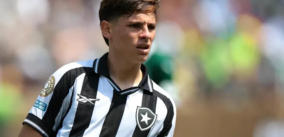 Player in black and white striped jersey on field