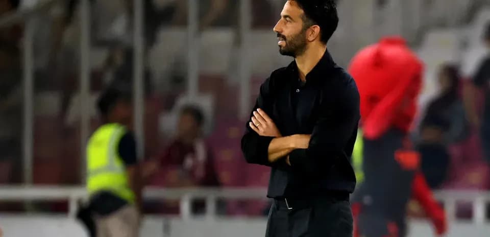 Coach observing the match from the sideline