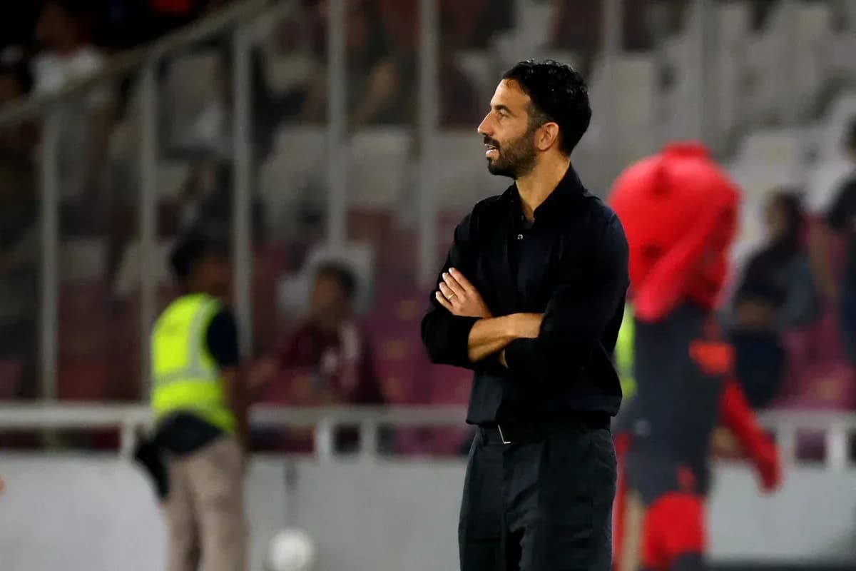 Coach observing the match from the sideline