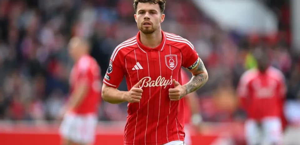 Player in red jersey running on the field