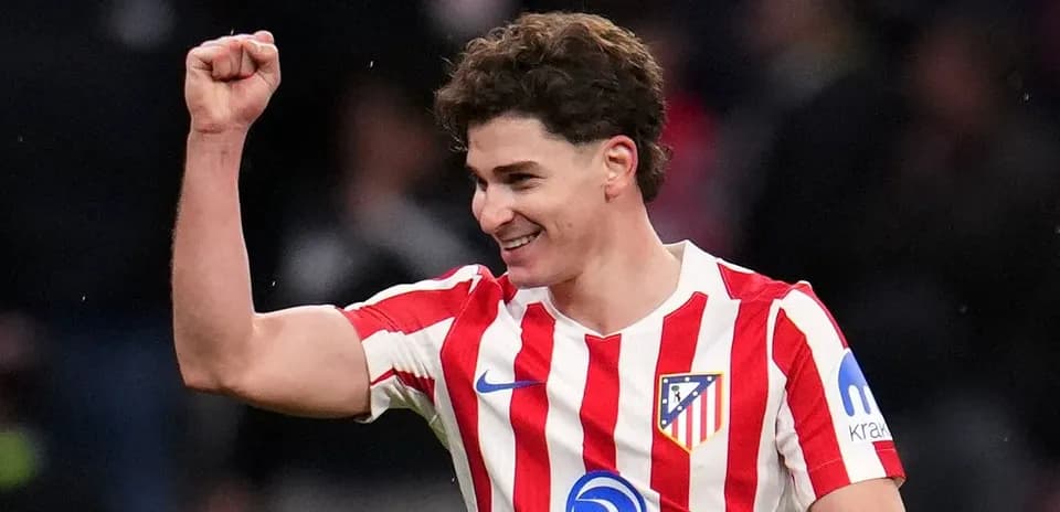 Atletico Madrid player celebrating with raised fist