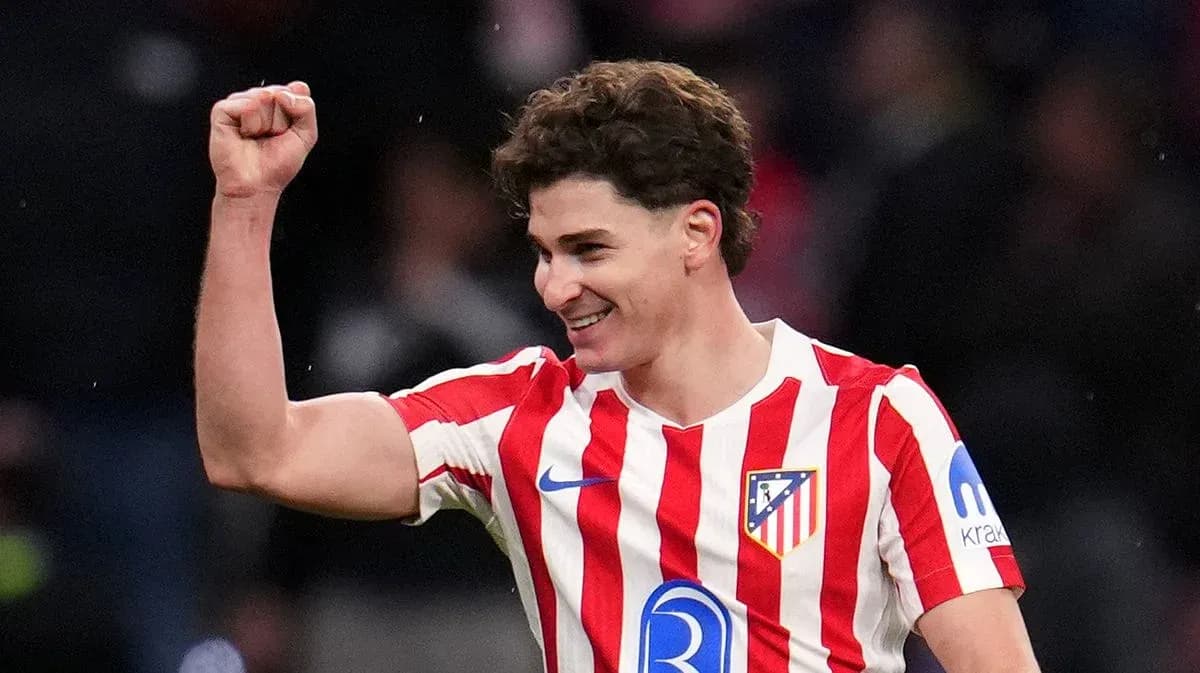 Atletico Madrid player celebrating with raised fist