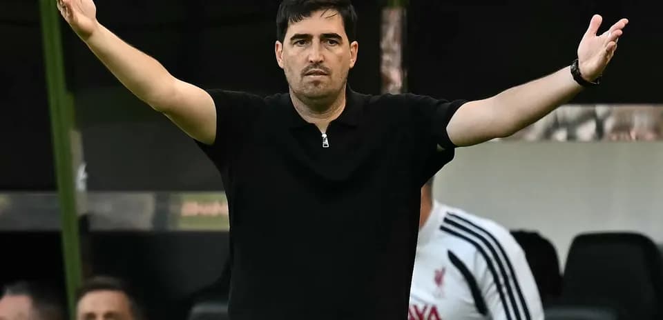 Coach gesturing during a match from the sidelines
