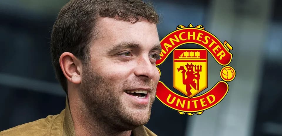 Man smiling with Manchester United logo in background