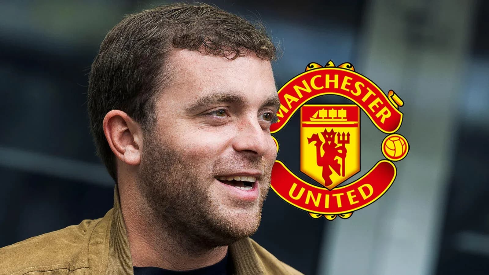 Man smiling with Manchester United logo in background