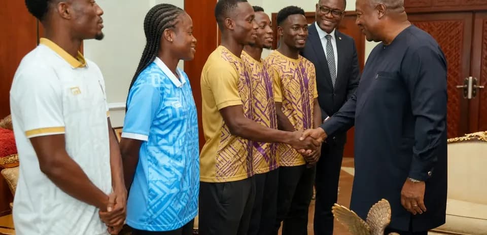 Athletes meeting official in formal setting