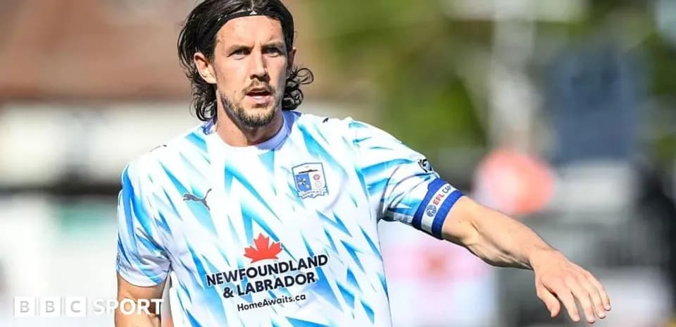 Player in blue and white kit during match