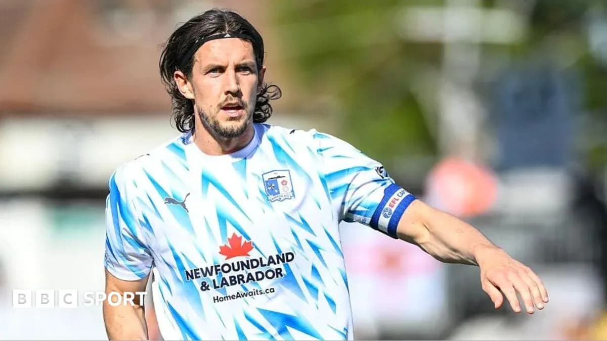 Player in blue and white kit during match