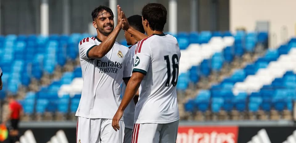 Real Madrid players celebrating a goal on field