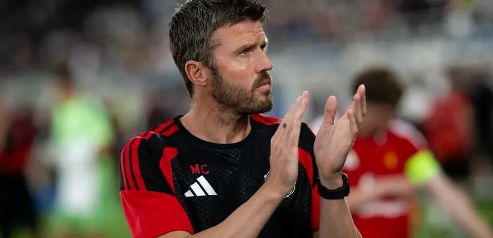 Coach applauding players after a match