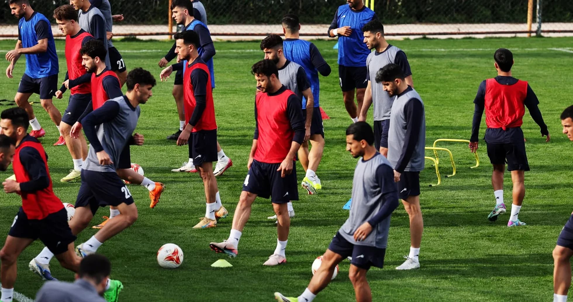 Players training on the pitch during practice session