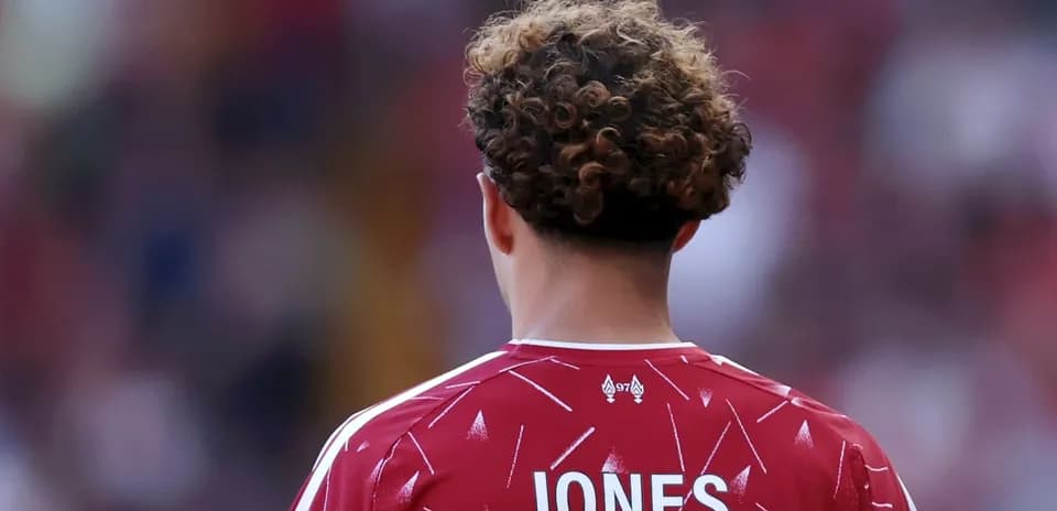 Player in red jersey with name 'JONES' visible