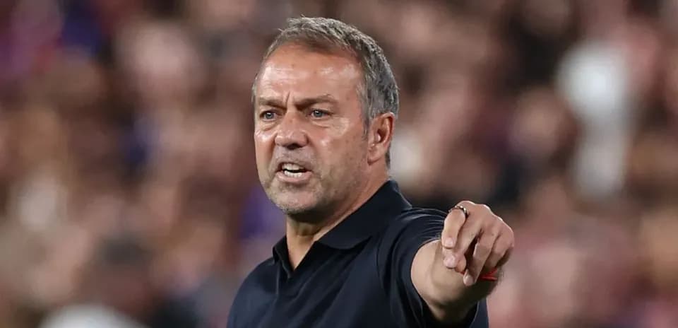 Coach gesturing during a match on the sidelines