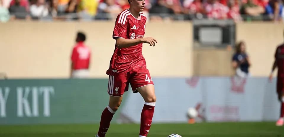 Player in red Liverpool kit during match action