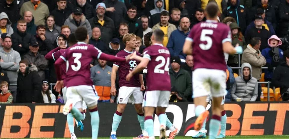 Burnley players celebrating a goal against Wolves