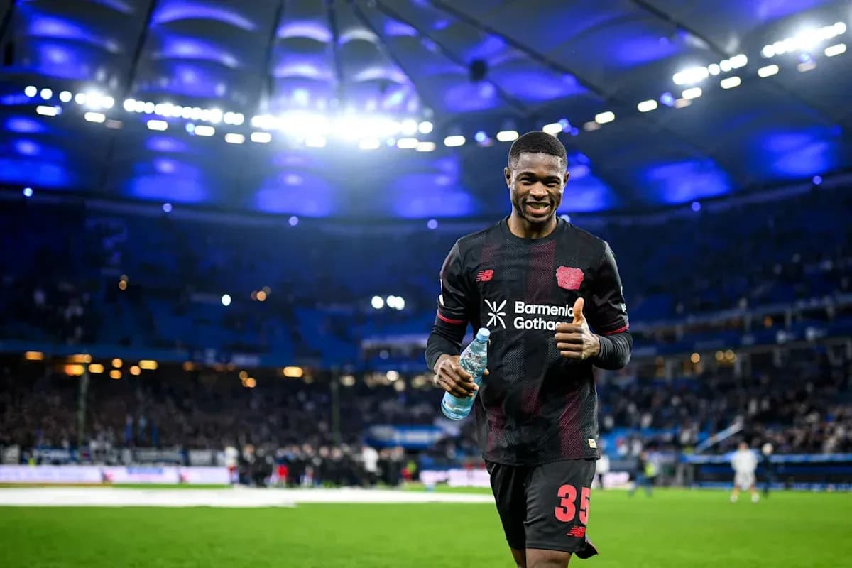 Player celebrating with water bottle on the pitch