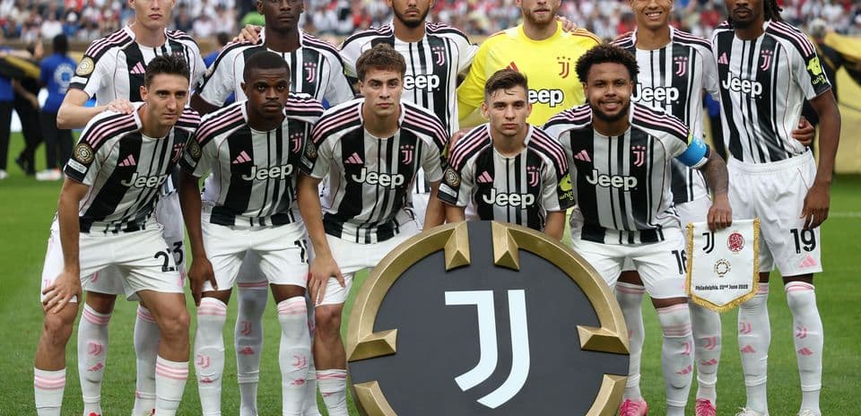 Juventus team posing with club emblem before match
