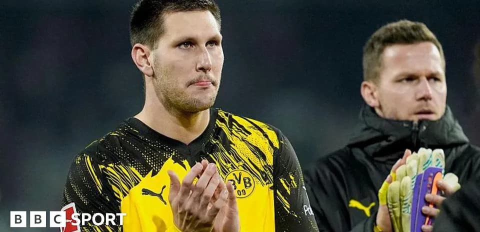 Goalkeeper applauding fans after a match