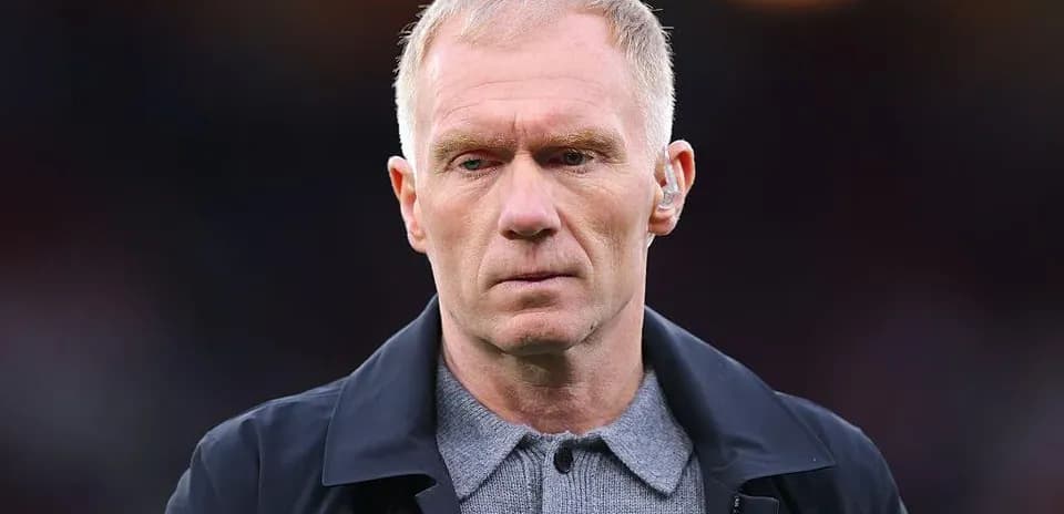 Man in formal attire with serious expression