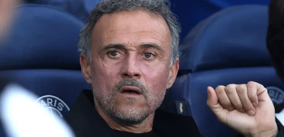 Coach observing from the bench during a match