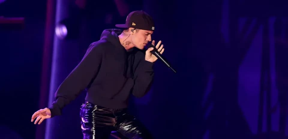 Artist performing on stage with microphone