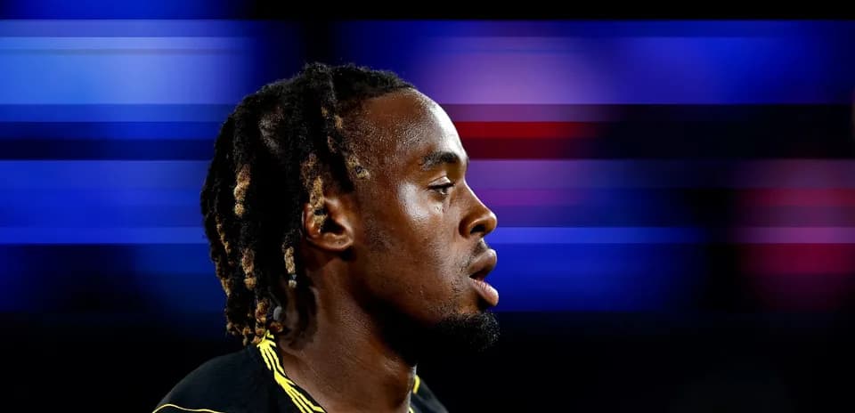 Athlete in profile with blurred colorful background