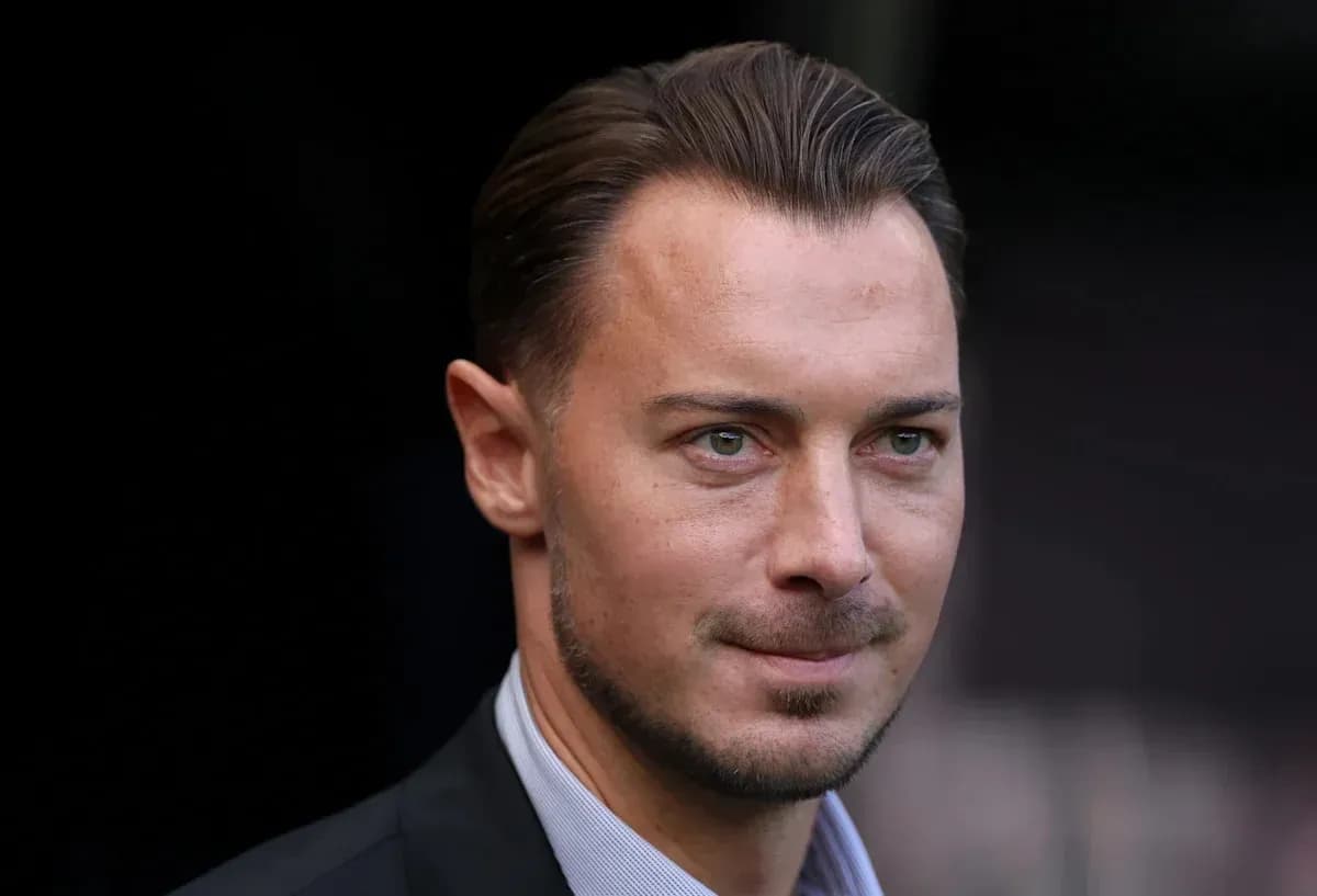 Man in suit looking towards the camera