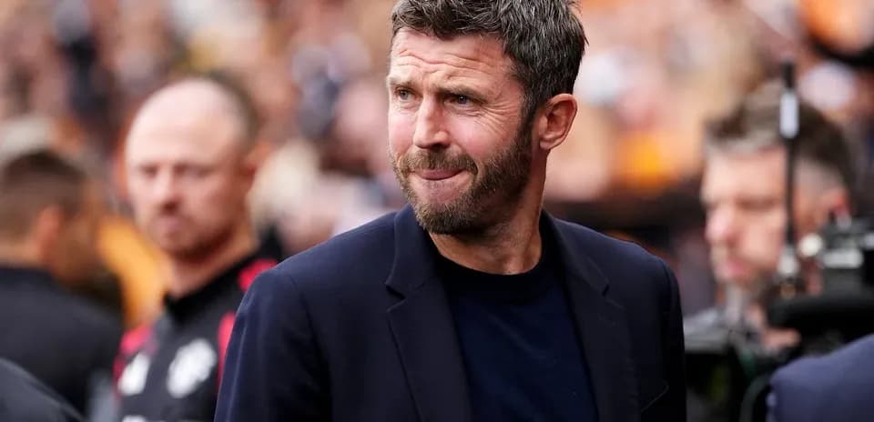 Manager walking on the pitch before match