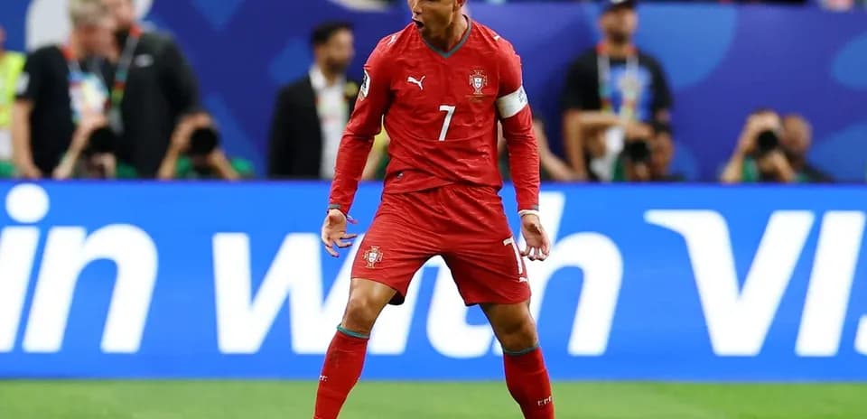Player celebrating in Portugal national team kit