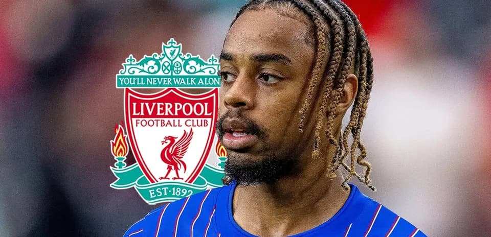 Player in blue jersey with Liverpool logo in background