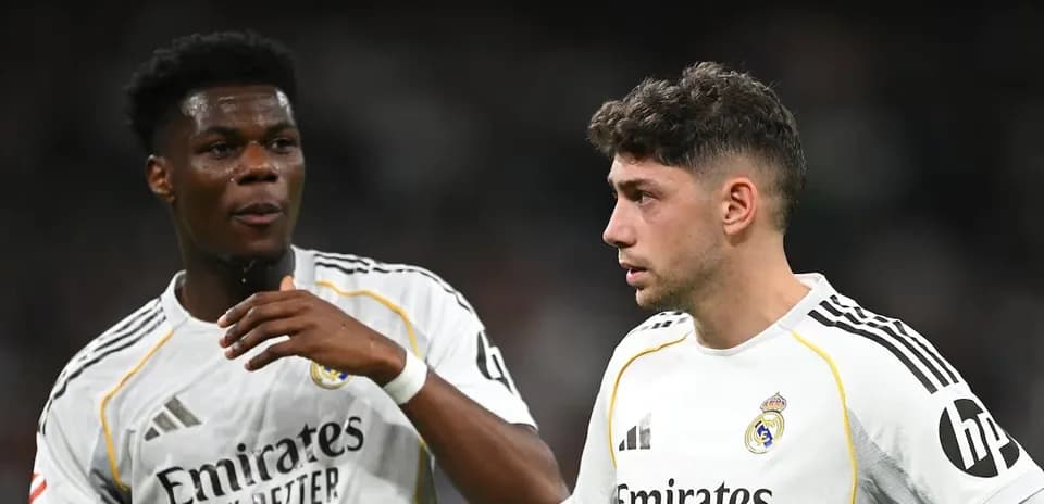 Two Real Madrid players discussing on the field