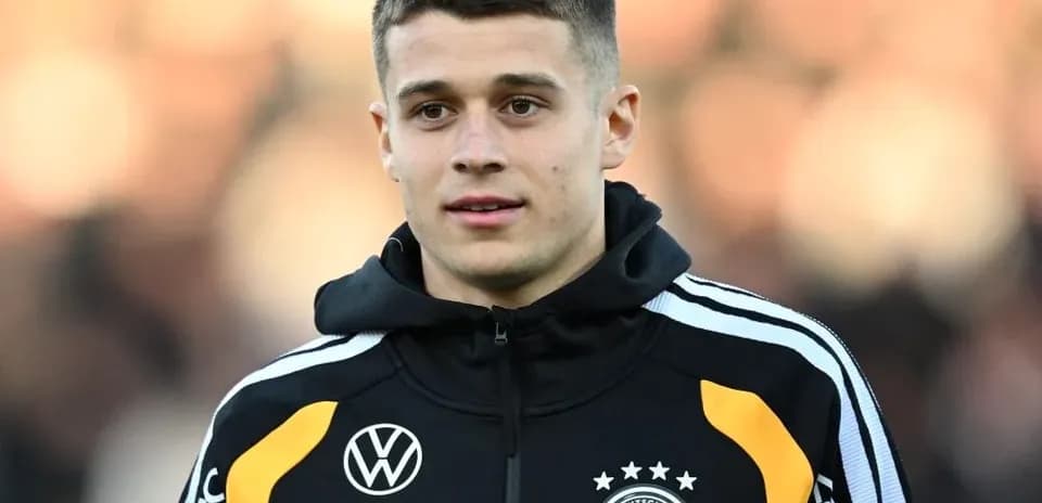 Player in Germany national team jacket during warm-up