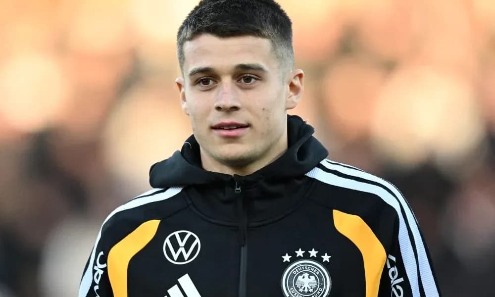 Player in Germany national team jacket during warm-up