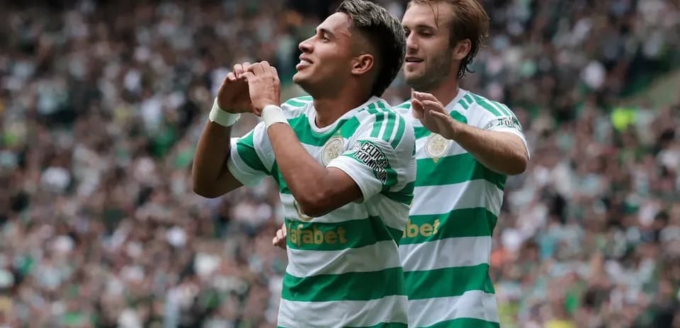Celtic players celebrating a goal during match