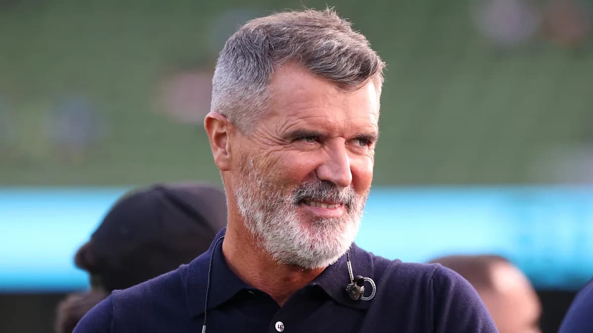 Man with gray beard smiling during event